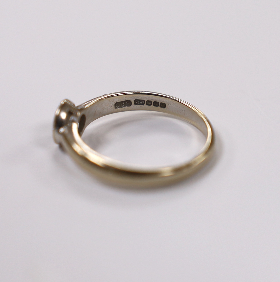 A modern 18ct white gold and collet set solitaire diamond ring size M, gross weight 3 grams.